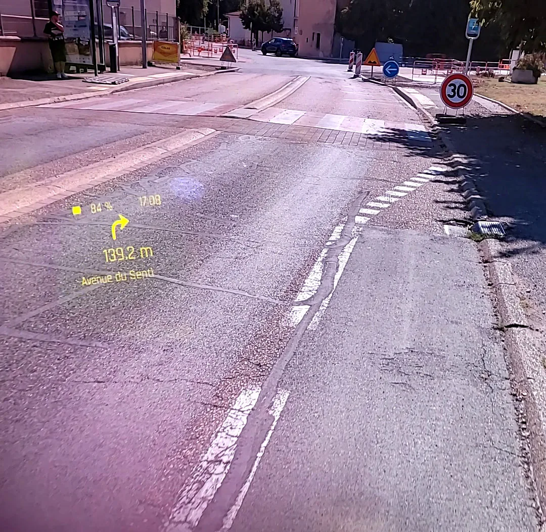 WheelDash navigation prototype on ENGO glasses: right turn in 139.2 m and the street name, over the road ahead